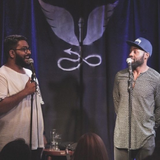 Two comedians facing off on the Roast Battle stage