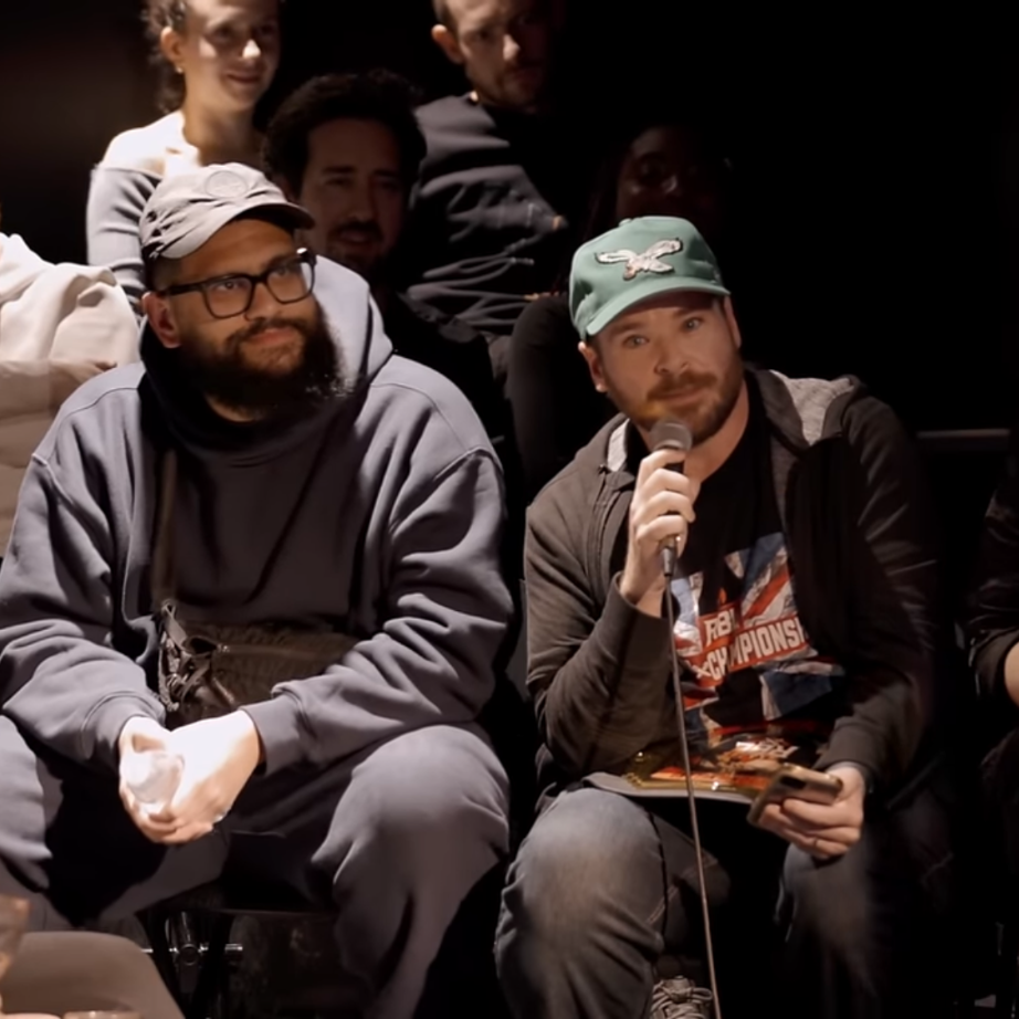 Roast Battle guest judges seated beside the stage